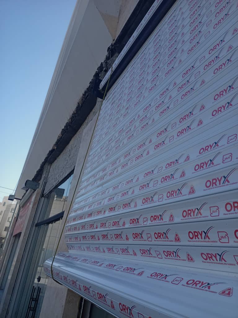 نصب و تعمیر شیشه سکوریت و جک پارکینگ آریا درب طاهری در پردیس