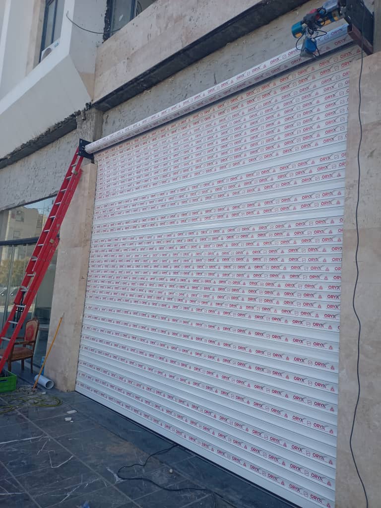 نصب و تعمیر شیشه سکوریت و جک پارکینگ آریا درب طاهری در پردیس