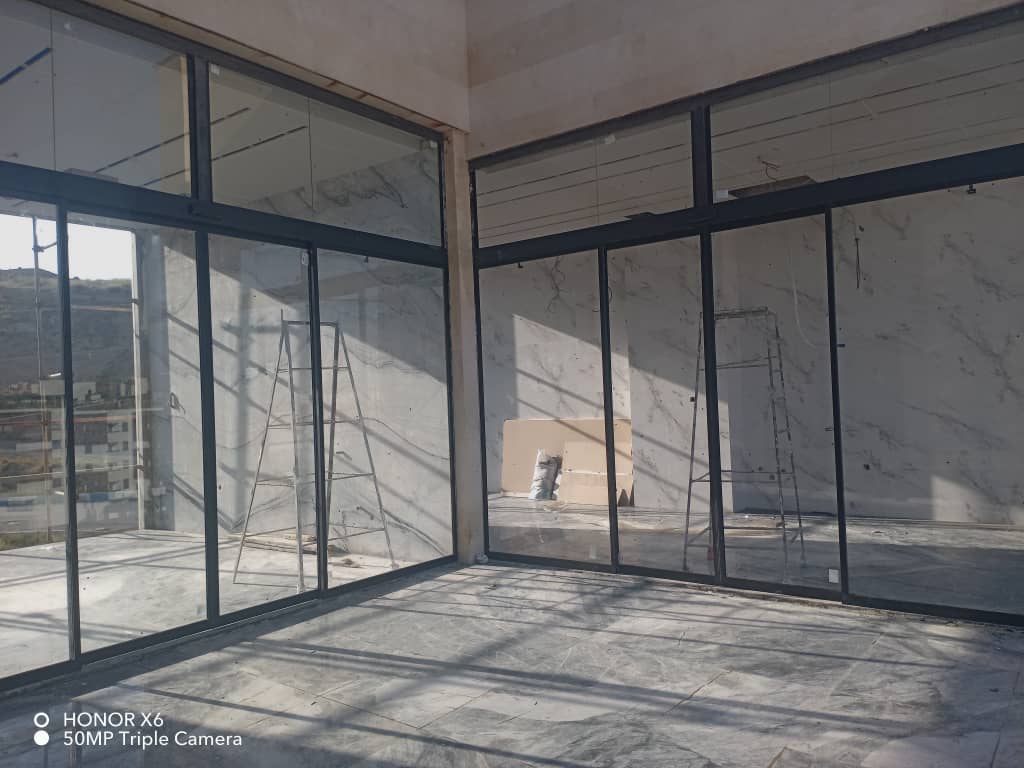 نصب و تعمیر شیشه سکوریت و جک پارکینگ آریا درب طاهری در پردیس